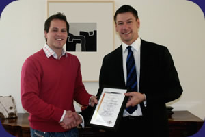 Ross Coomber (left) receiving his Special Award from Peter Earl